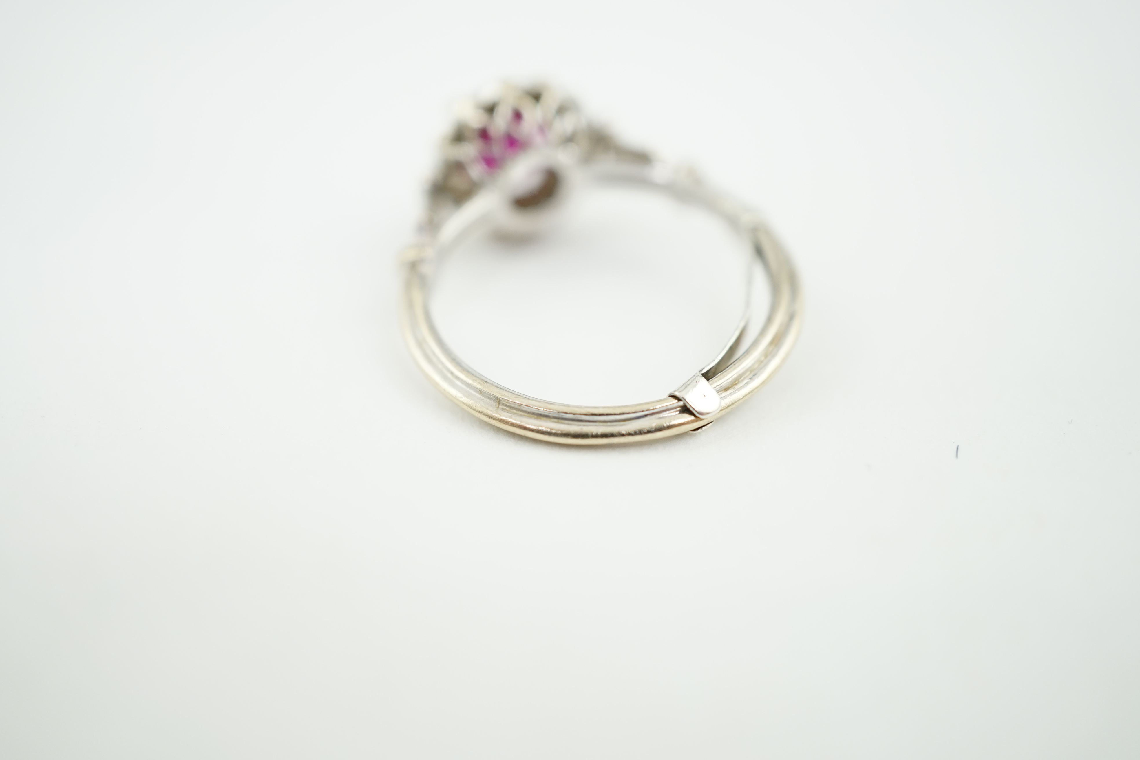 A recent 18ct white gold, ruby and diamond set cluster ring